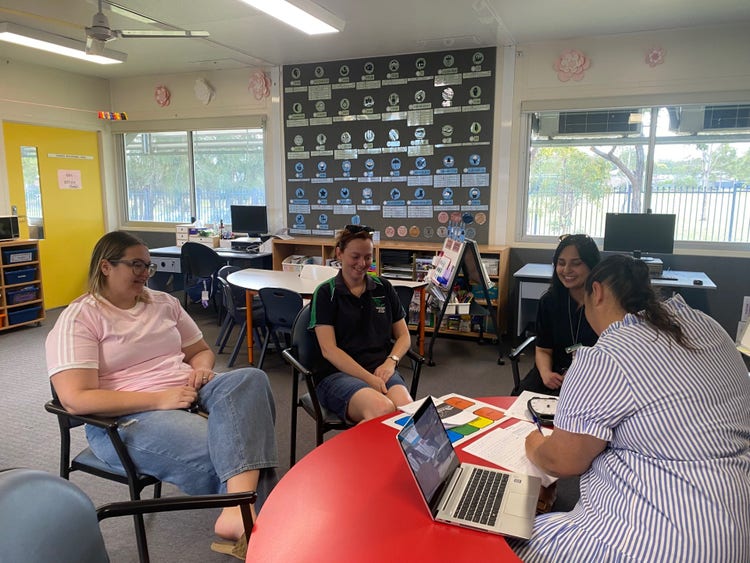 a teacher having a meeting with a parent for learning support
