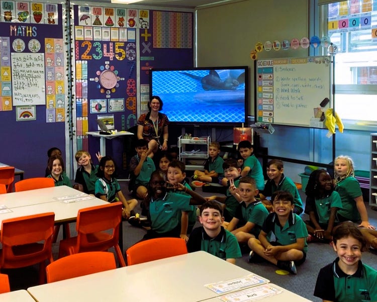 a classroom of students and a teacher